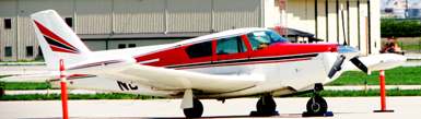 Heavy hot-rod of the air:  the sleek, lightweight, aluminum-skinned 250-hp PA-24-250 Comanche -- shown here in its rare, hefty 400-horsepower variant.