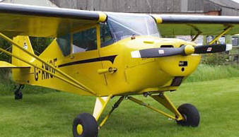PA-17 Vagabond:  basically a Cub, with side-by-side seating for two, and with shorter wings -- for a little extra speed.
